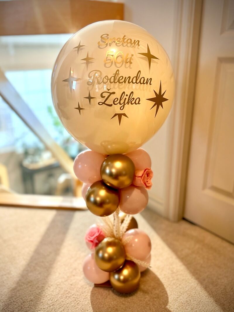 Custom birthday balloon stack in vibrant colours