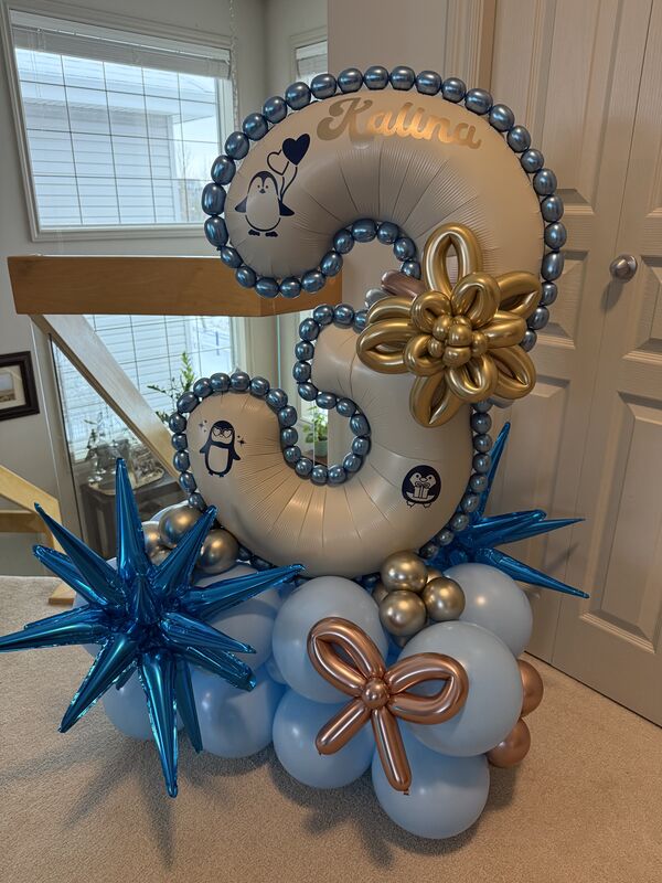 Elegant birthday balloon display setup