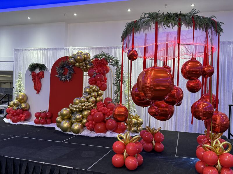Festive holiday balloon display in red and green