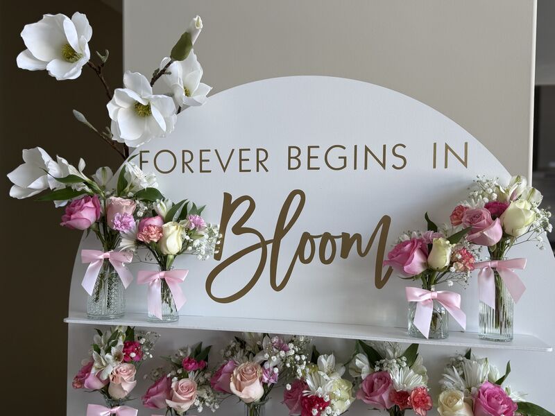 Elegant wedding balloon display with gold and white accents